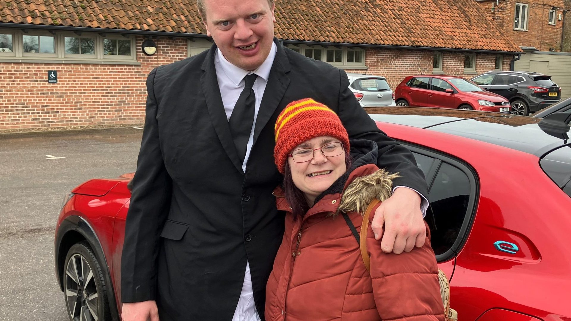 Jamie with his arm around Lorraine outside Doddington Hall