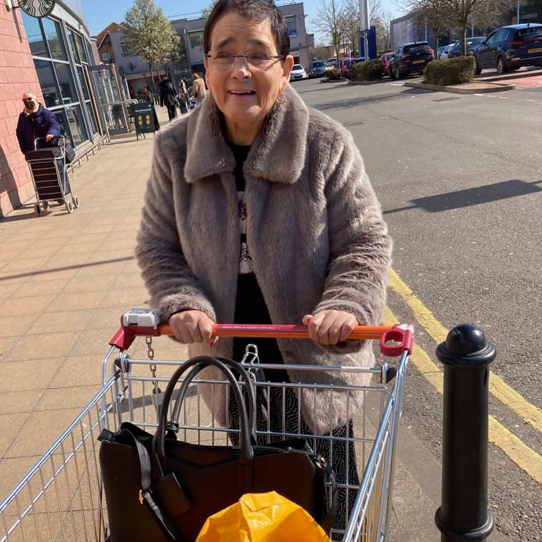 Jackie pushing a shopping trolley