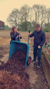 AJ and a support worker gardening