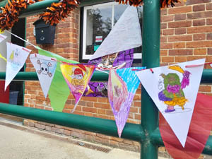 Colourful home-made bunting hanging on railings