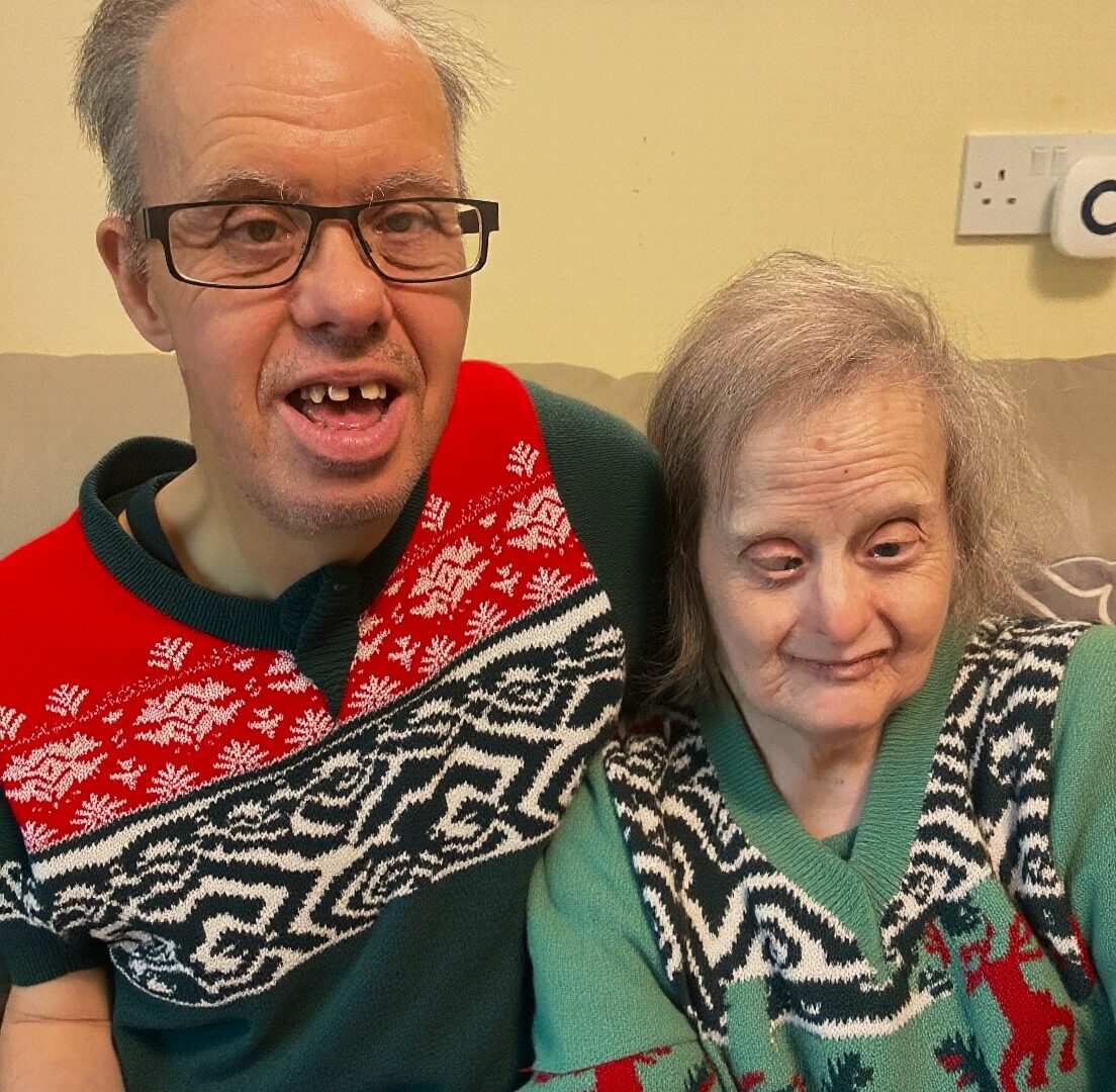 Peter and Philippa wearing Christmas jumpers
