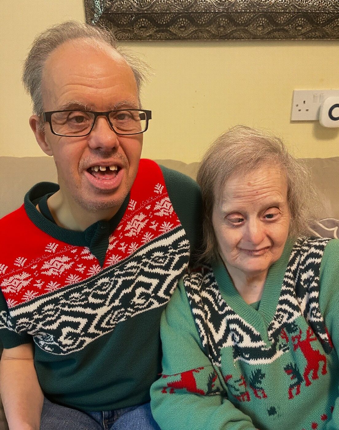 Peter and Philippa wearing Christmas jumpers