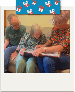 Phillippa and Peter looking at their photo album