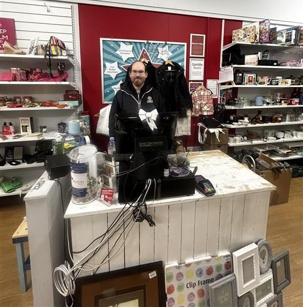Patrick working at the charity shop