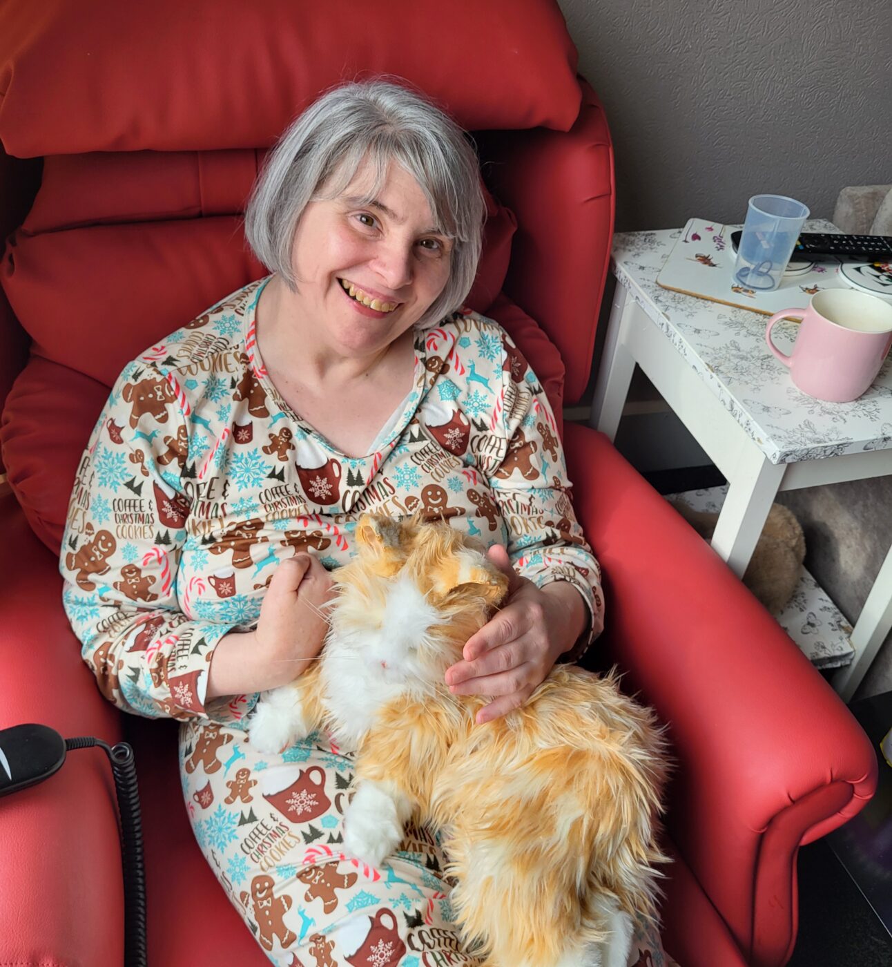Ellen with her cat funded by the lottery
